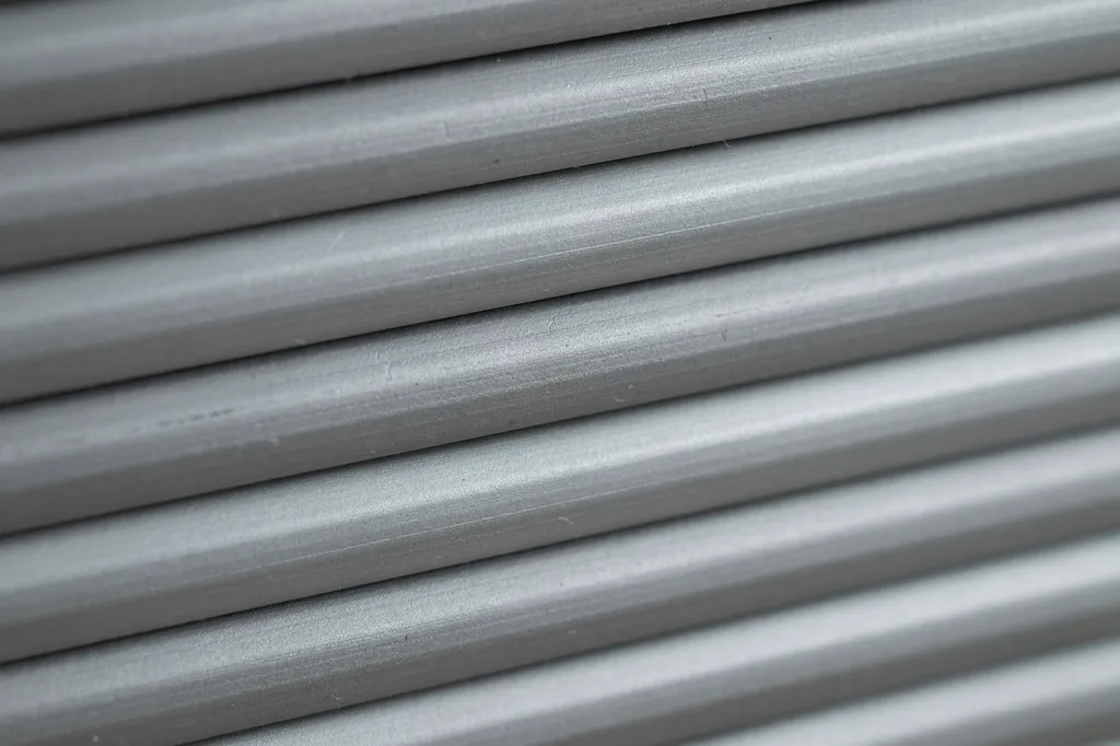 Close-up of brushed aluminum rolling shutter slats texture